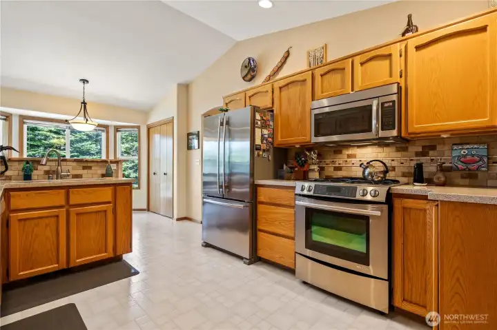 Spacious kitchen with center island and breakfast nook.