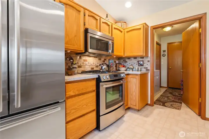 Stainless steel appliances and convenient kitchen layout.