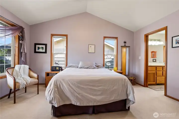 Spacious primary suite with vaulted ceilings and ensuite bath.