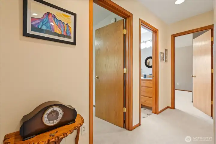 Hallway connecting bedrooms and bath