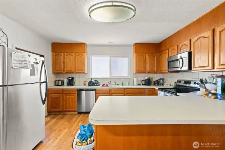 Lots of cupboards and countertop space in this spacious kitchen. Lots of cupboards and countertop space in this spacious kitchen.