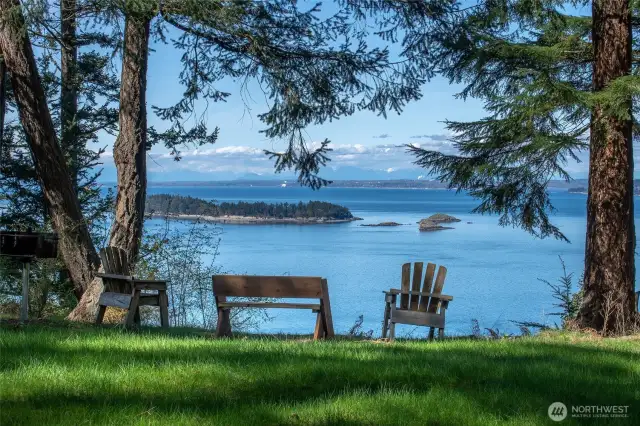 Another community area with picnic tables and benches to enjoy views toward Barnes and Clark islands. The trail to the saltwater beach is off the parking area (not pictured).