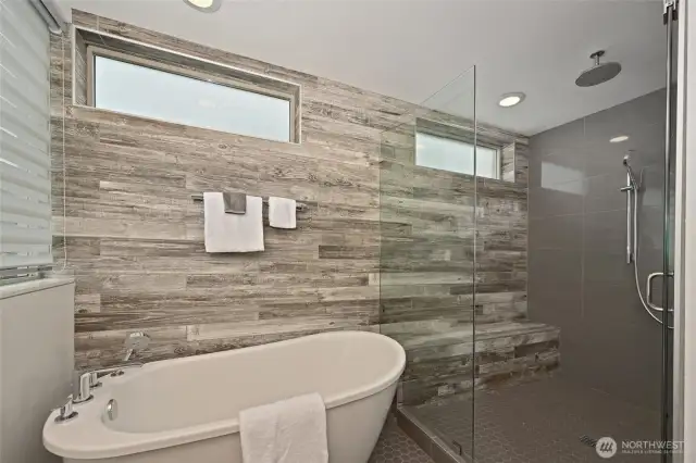 Separate soaking tub and oversized shower.