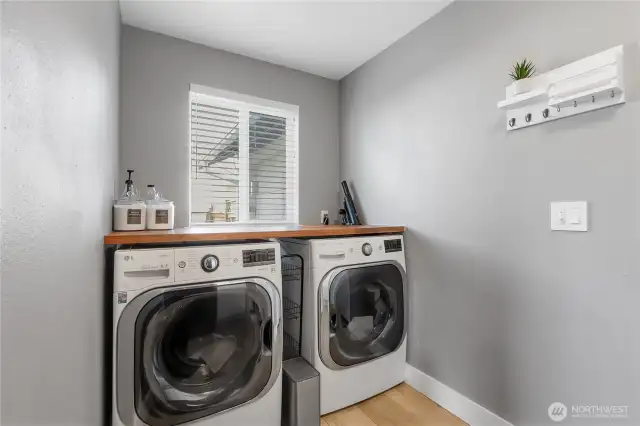 Walnut Shelving can be found throughout the home including in the utility room.