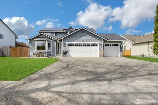 3 Car Garage with the right most bay being a pass through to the backyard.