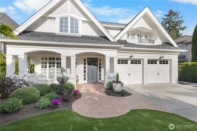 Better than new — this home features elegant window treatments, a dream turf lawn, mature landscaping, air conditioning, wired for a generator, and numerous high-end upgrades throughout.