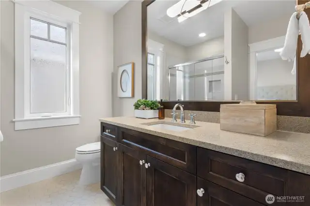 A spacious and beautifully appointed 3/4 bath, perfect for family or guests.