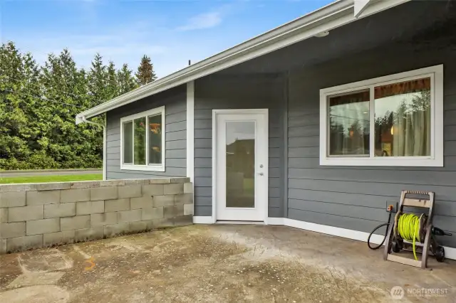 Patio off the kitchen and dining area. Covered for barbecuing and entertaining.
