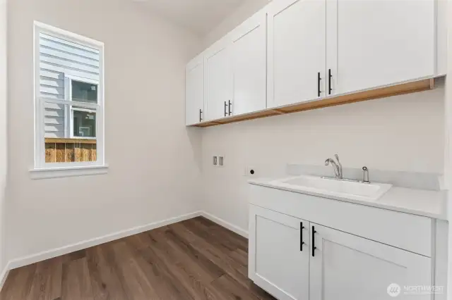 Laundry Room with Cabinets and Sink