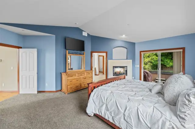 French doors to primary suite with fireplace