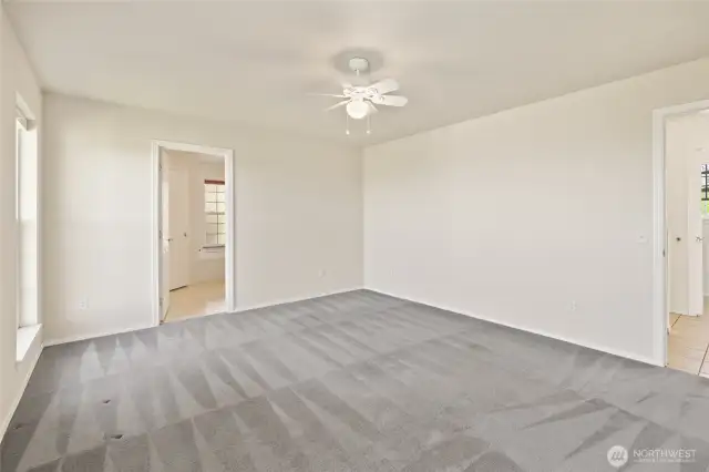 Primary bedroom with attached bathroom