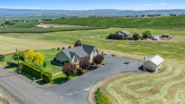 Surounded by ag ground, this home is perched to perfectly take in the views from all directions!