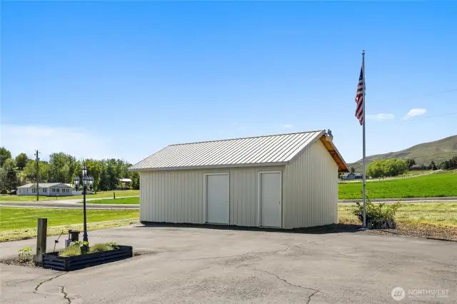 Utility building with water system room and open storage or hobby room