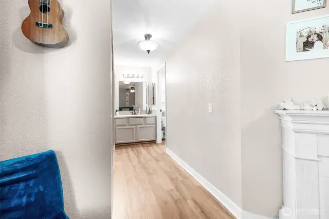 Hall area to Primary full bath and closets.