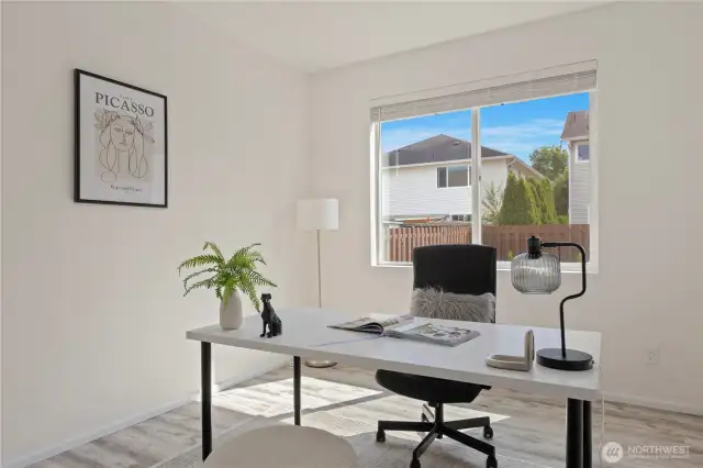 Main floor bedroom staged as an office