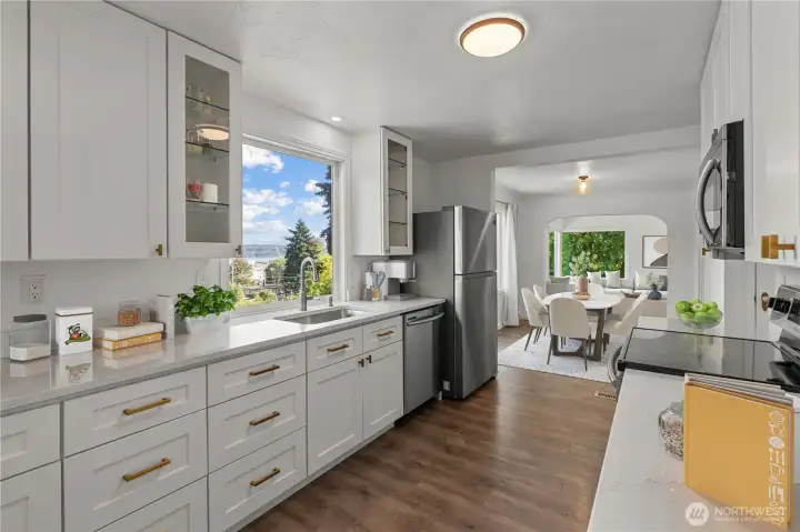 Ample cabinets and quartz counters highlight the functional kitchen.