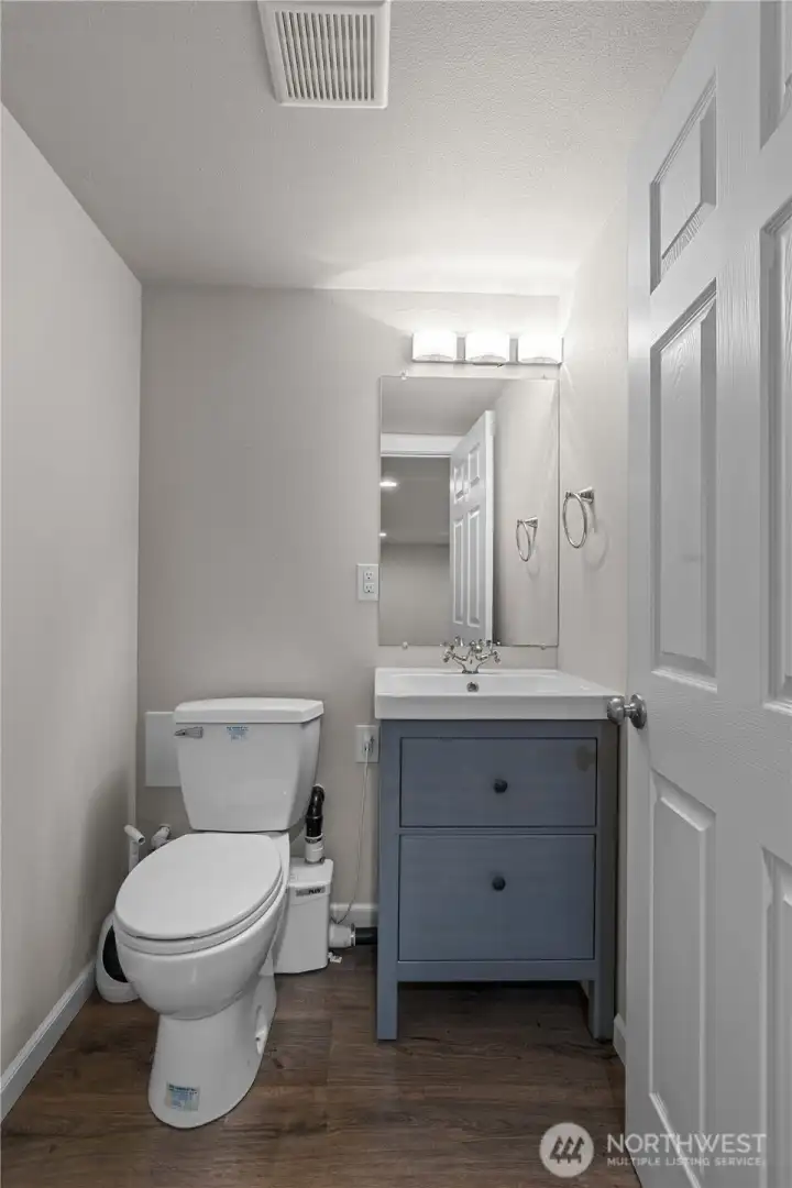 Half bath, conveniently located in the finished, walkout basement.