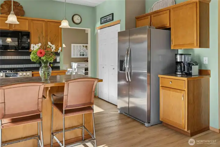 Open kitchen with newer appliances and large pantry