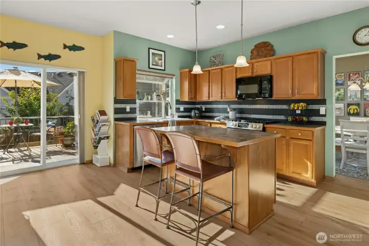 Bright and open kitchen overlooking the great room and fireplace