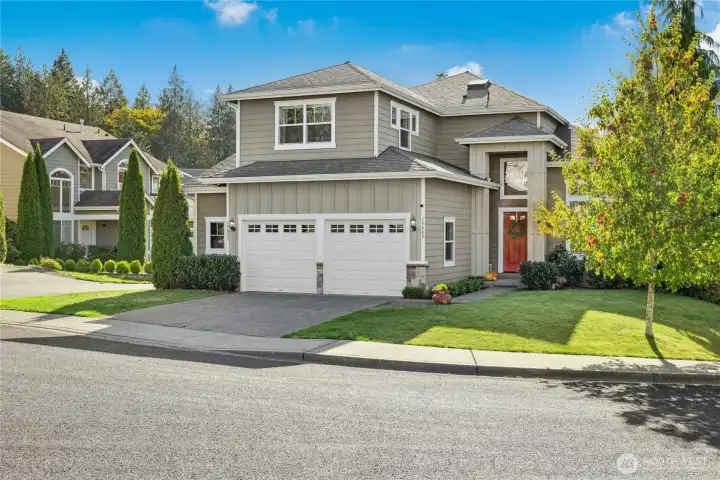 Garage is oversized with room for two full sized vehicles and racks of storage