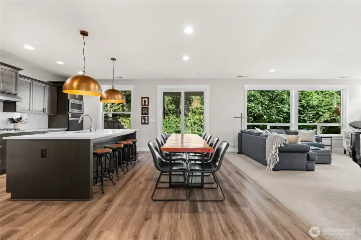 The open-concept great room provides a harmonious transition between the kitchen, dining, and living spaces—perfect for both everyday living and entertaining.