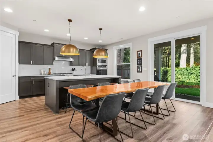 Bright and airy, this open living area looks out onto a peaceful, private backyard.