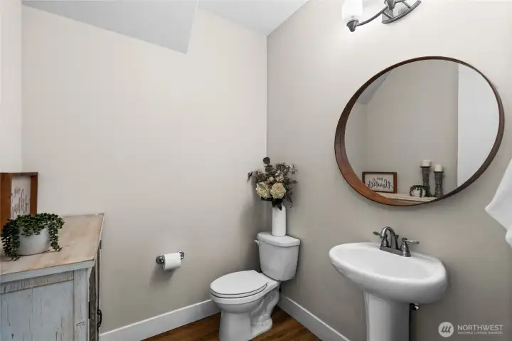 Located off the kitchen and great room, the powder room is spacious and convenient.