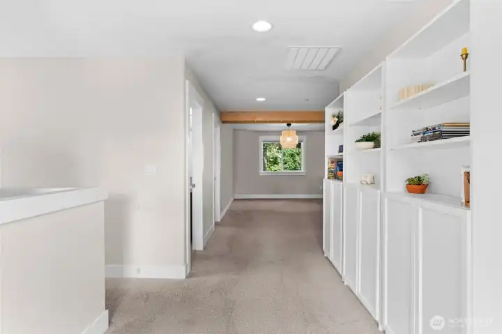 A wide hallway space opens up to a large loft area, perfect for a media room, play room or flex space to fit your lifestyle.