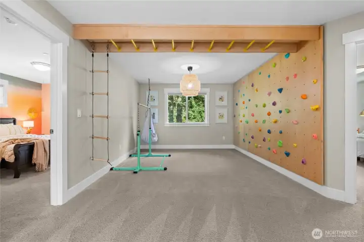 Create your own home "Gymboree" with this built in play system.  Easily removable, this space can be cleared out if desired.