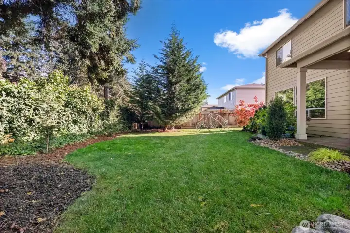 Enjoy plenty of level, grassy space in a fully fenced backyard—perfect for relaxing, playing, or spending time with your loved ones.