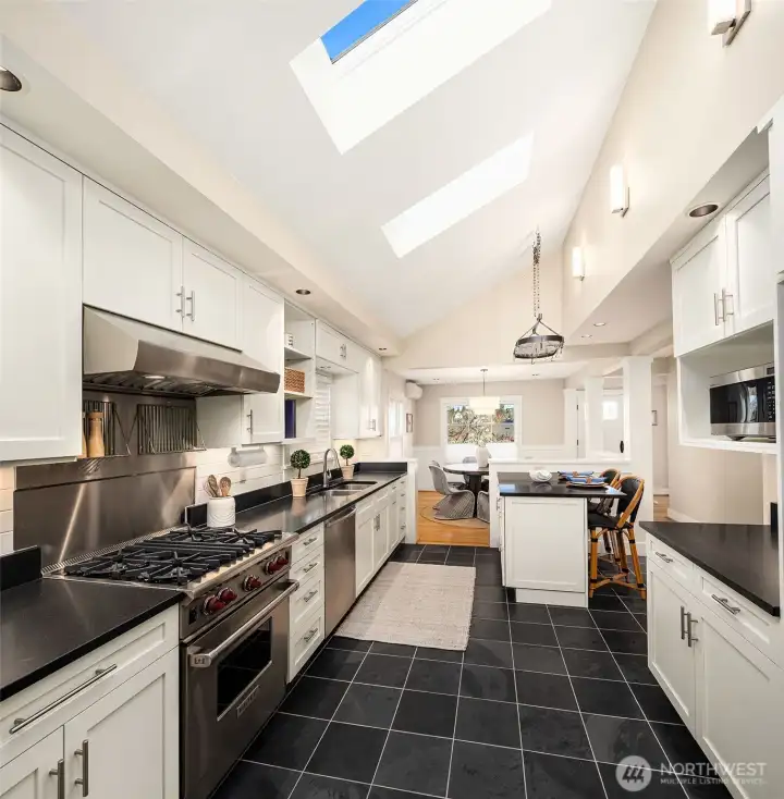 Kitchen looking east to the dining area. Behind is the pantry. Great open flow with two skylights!