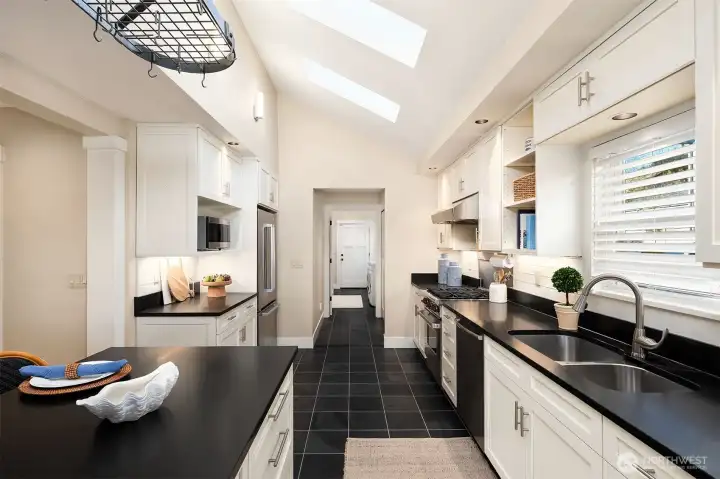 Looking west to the door to the garage. Single level access from garage to main floor.