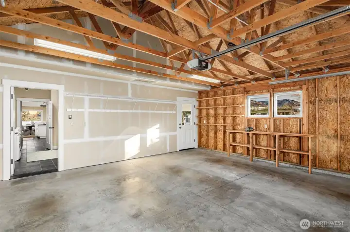 Extra large two-car garage with EV outlet. Alley access.