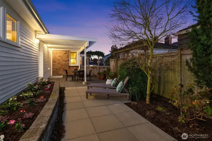 South side of house fully-fenced for private, outdoor relaxation.