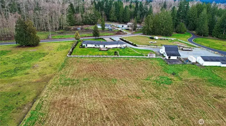 Further back East view of the house and pasure.