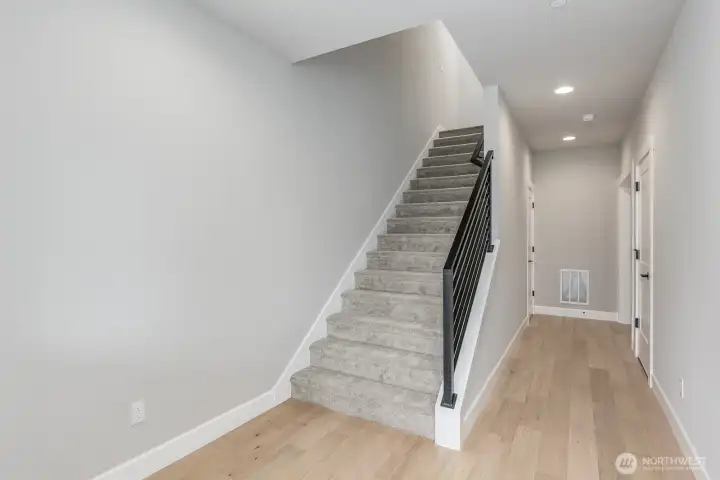 Welcoming entry with hardwood floors leads to a Jr Ensuite/Bonus room down the hall.
