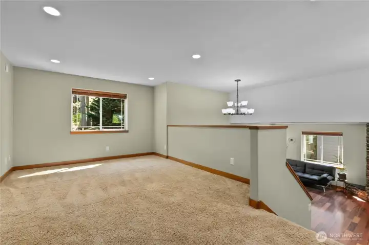 Upper-level bonus/loft space provides flexibility for a second living area, playroom, or home office setup.