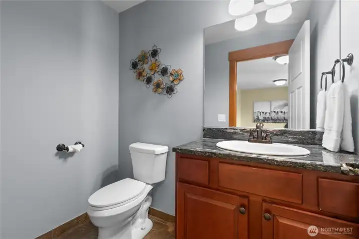 Stylish powder room with updated finishes and convenient main-level access for guests.