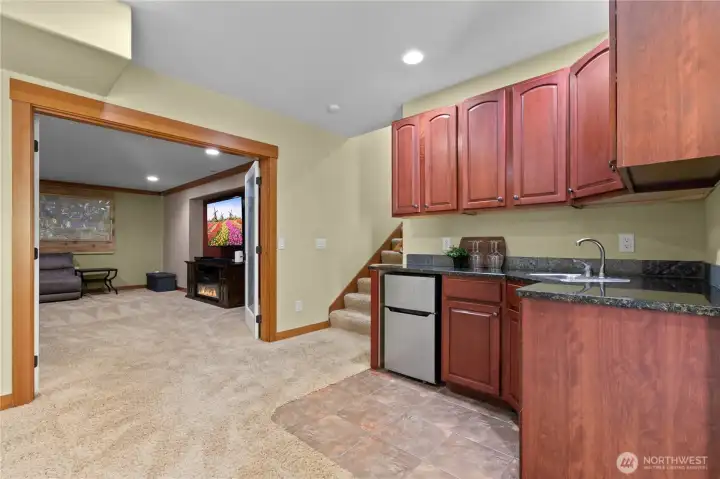 Lower-level kitchenette area offering added convenience for guests or extended living flexibility.