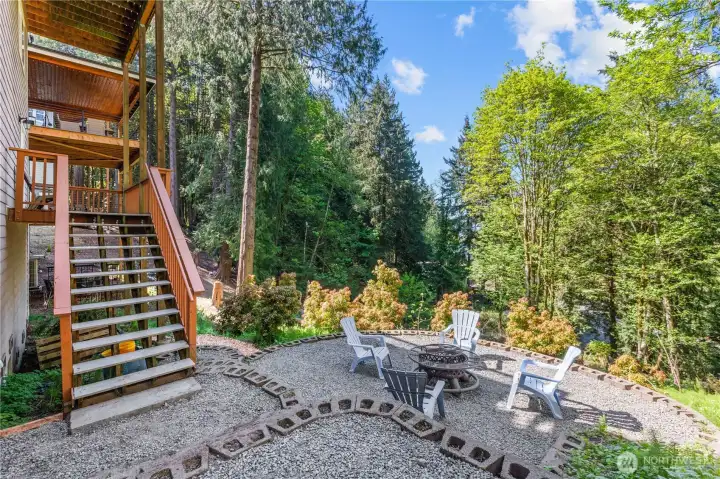 Multi-level home with decks, patio space, and a peaceful wooded setting near Lake Whatcom.