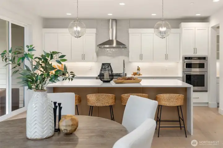 Stunning chefs' kitchen with double ovens and Kitchen-Aid appliances.