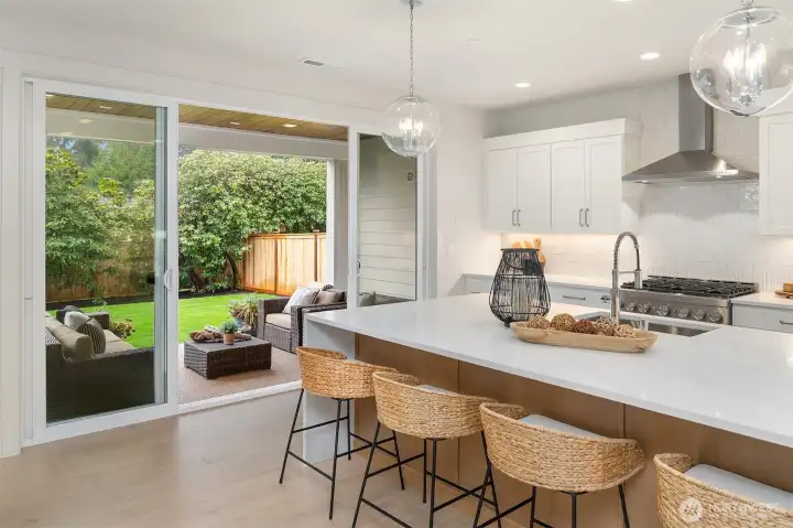 Oversized slider and windows make this kitchen and great room bright and cheery!