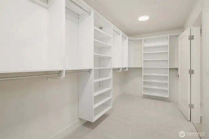 Large walk-in closet in primary suite.