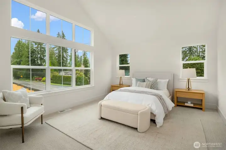 Second story bedroom with HUGE windows and vaulted ceilings.