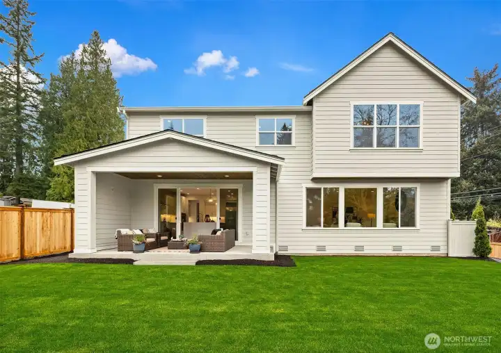 Level, large backyard with irrigation, full fence and gate on one side.
