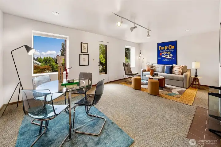 Ground floor family room with private deck which looks out to the Arboretum and Cascade mountains, with wood burning fireplace.
