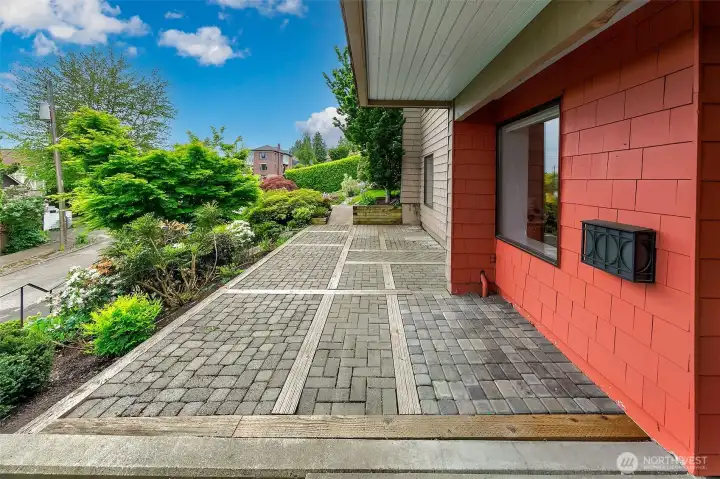 The partially covered patio on the garden level. Arboretum and territorial views.