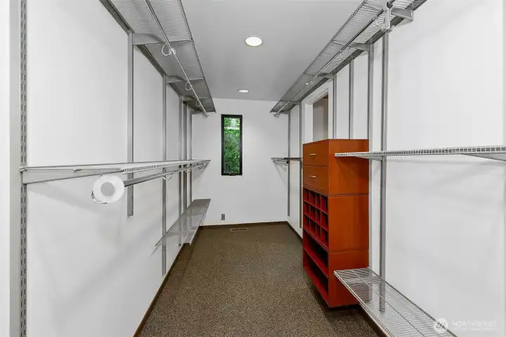 Large walk-in-closet for the primary bedroom.
