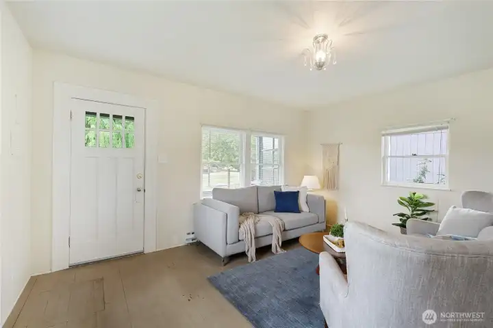 Another view of the entry/living room, notice the beautiful modest chandelier