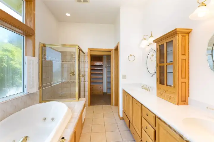 primary bath with jetted tub and large shower